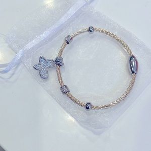 Classy gold cable bracelet with butterfly charm